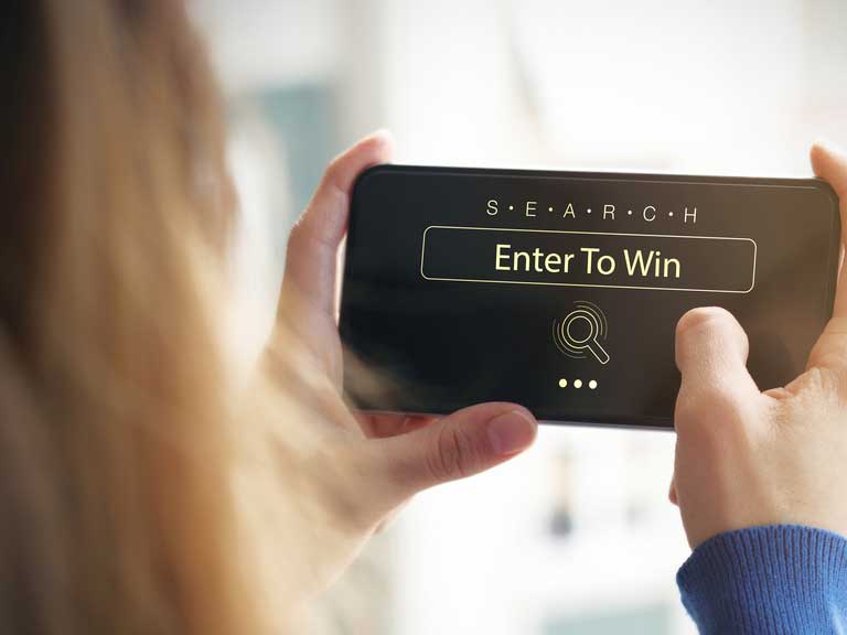 Woman entering competition on smartphone