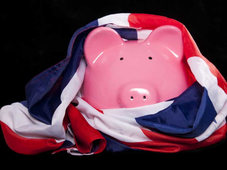 Piggybank draped in a Union Jack flag