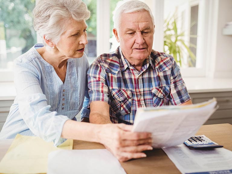 An older couple realise they've been scammed from their bank account statements