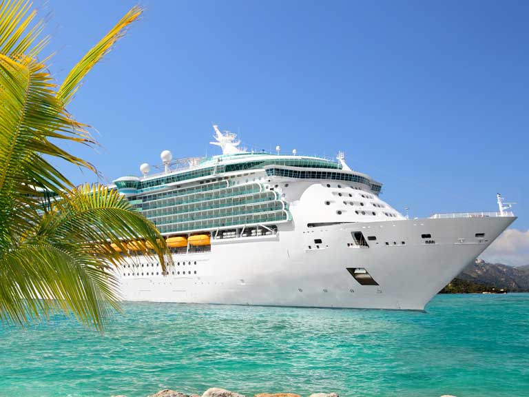 Picture of a cruise ship in a tropical port to represent fake luxury holiday prizes