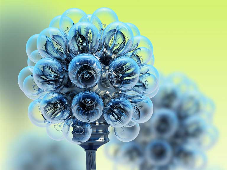 Dandelion made of electric light bulbs to represent energy saving