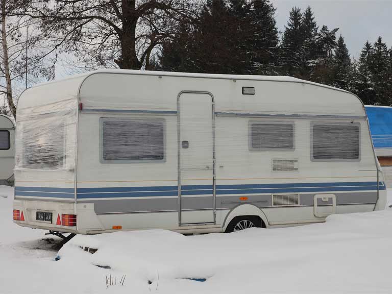 Caravan in winter snow