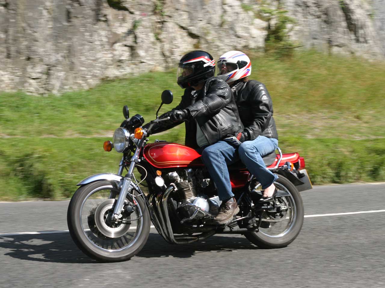 Motorbike with a driver and pillion passenger