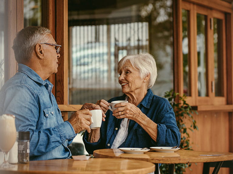An older couple chatting on a first date