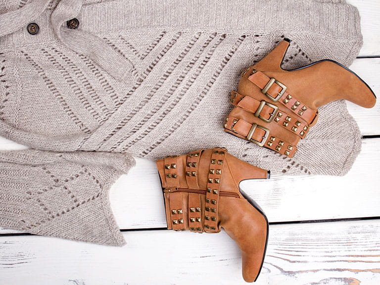 A knitted cardigan and ankle boots