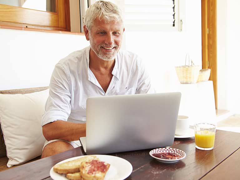 An older man finds out how to set up a Facebook Page for his small business