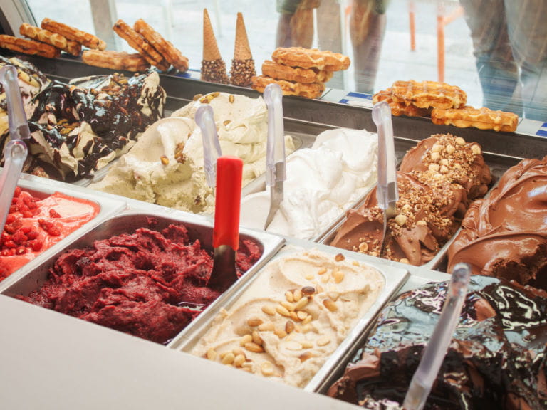 The counter of an ice cream parlour in Italy with a wealth of different gelato on display