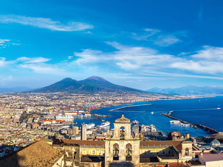 Napoli (Naples) and mount Vesuvius in the background at sunset in a summer day, Italy, Campania