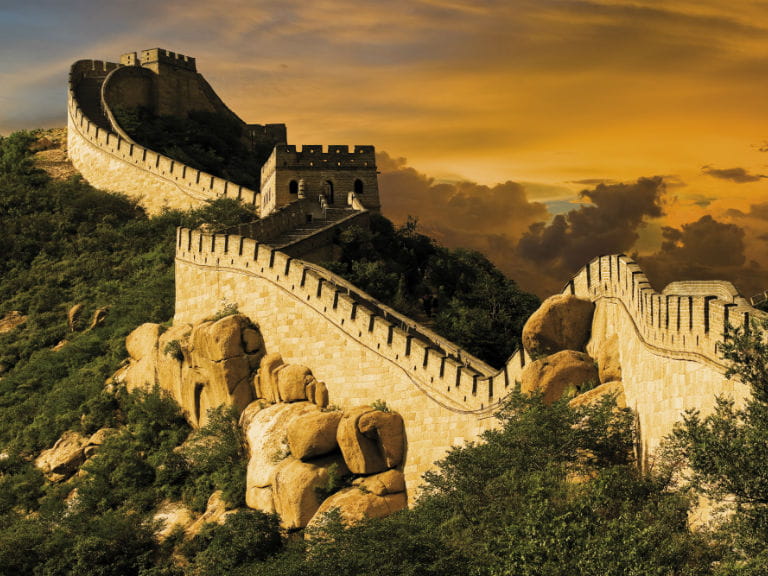 A section of the Great Wall of China at sunset