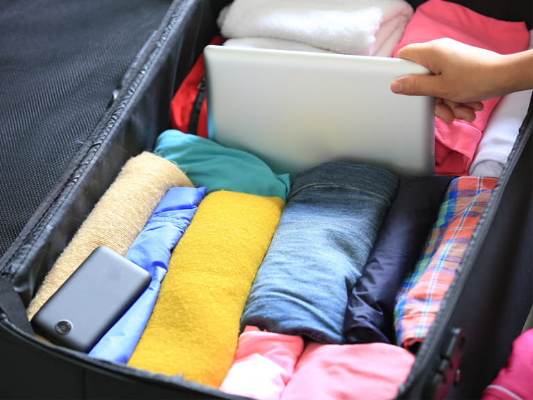 A suitcase being packed