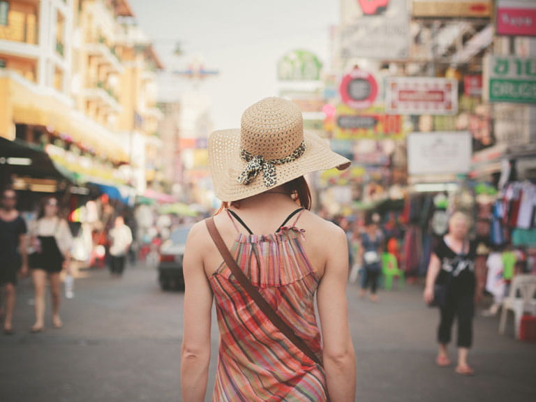 Woman looking at a busy Asian city