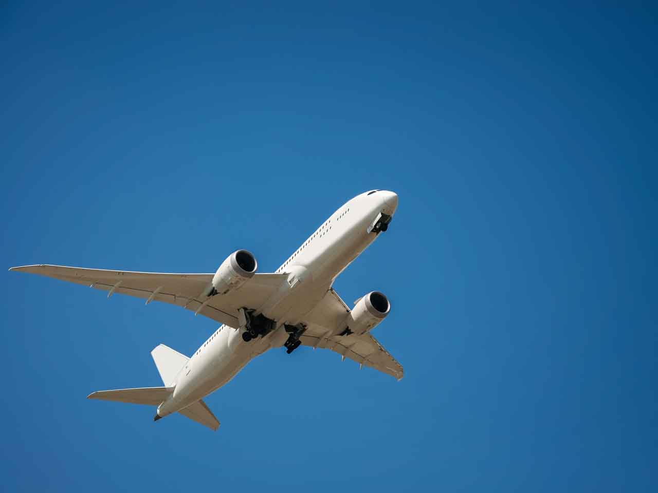 Aeroplane ascending against a blue sky. 