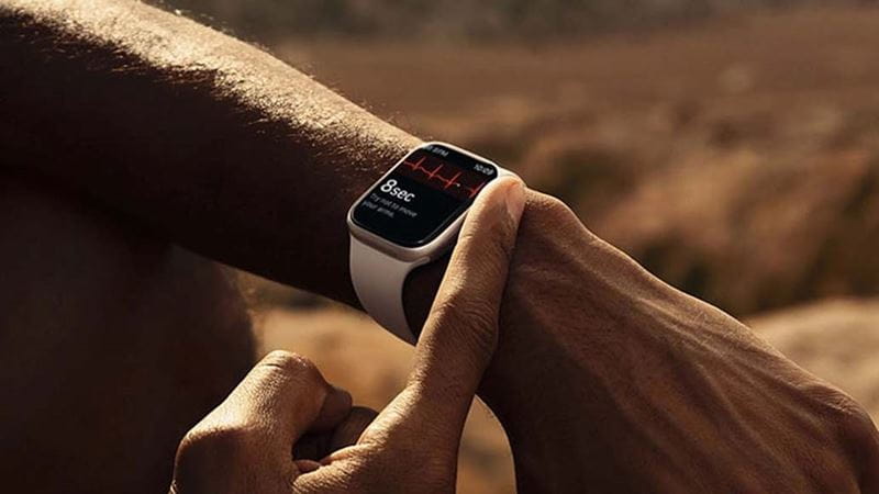A man checking a smartwatch on his wrist