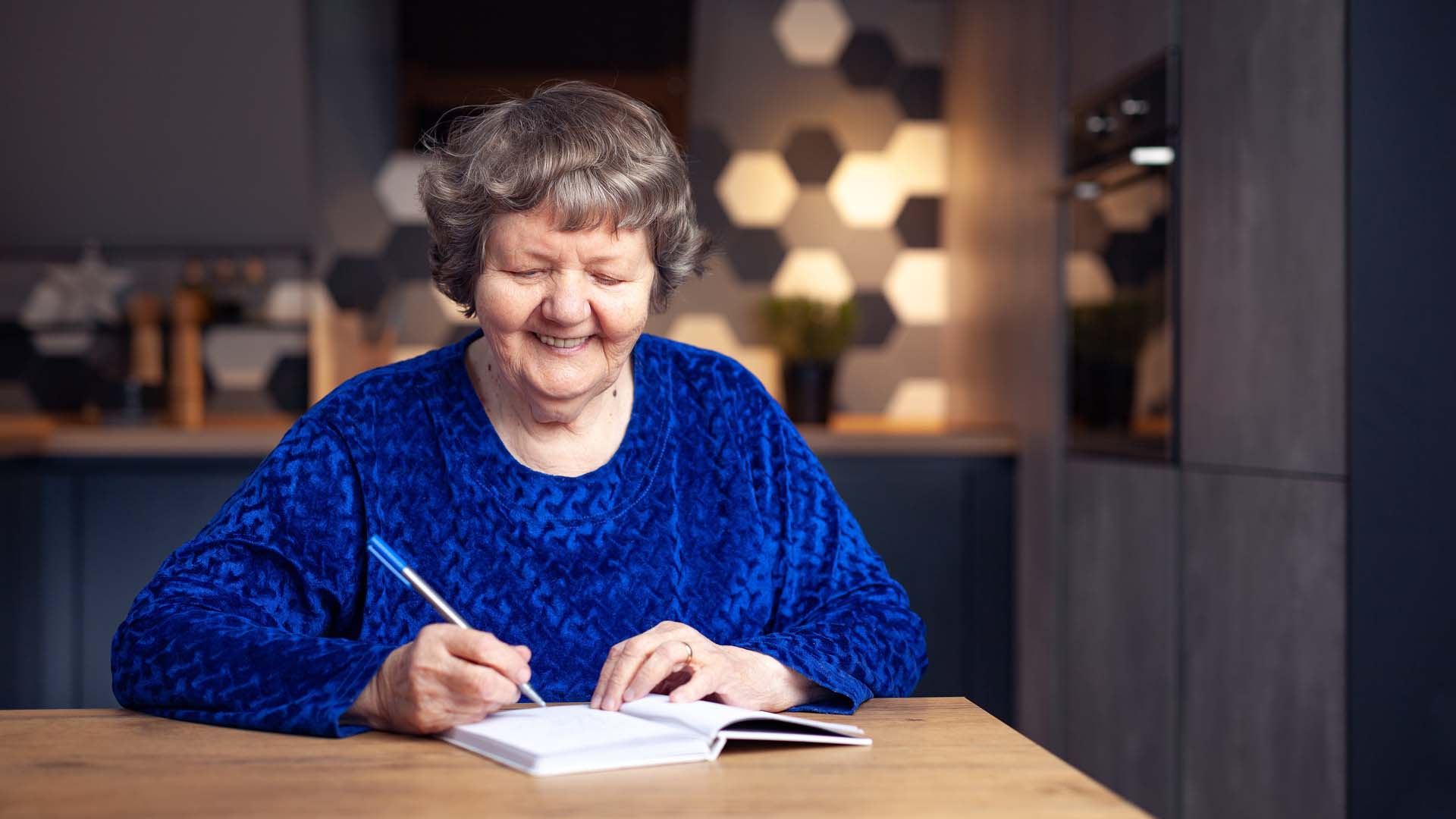 A woman writing in a notebook