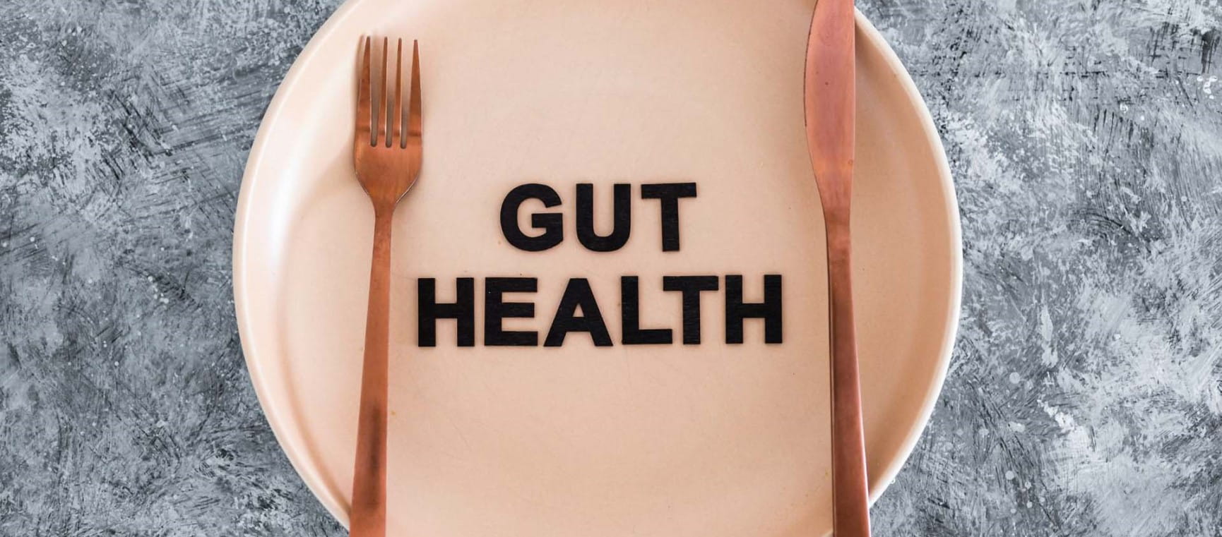 A large bowl with the words "GUT HEALTH" written on it