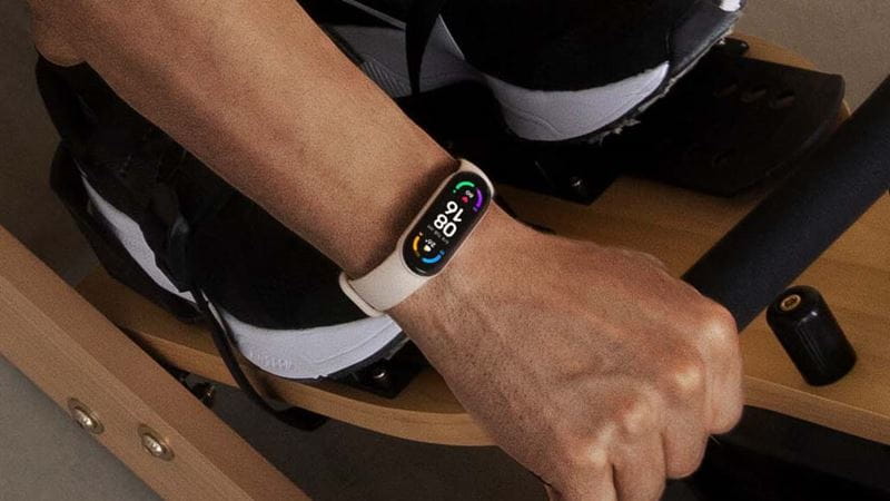 A man wearing a fitness tracker on his arm