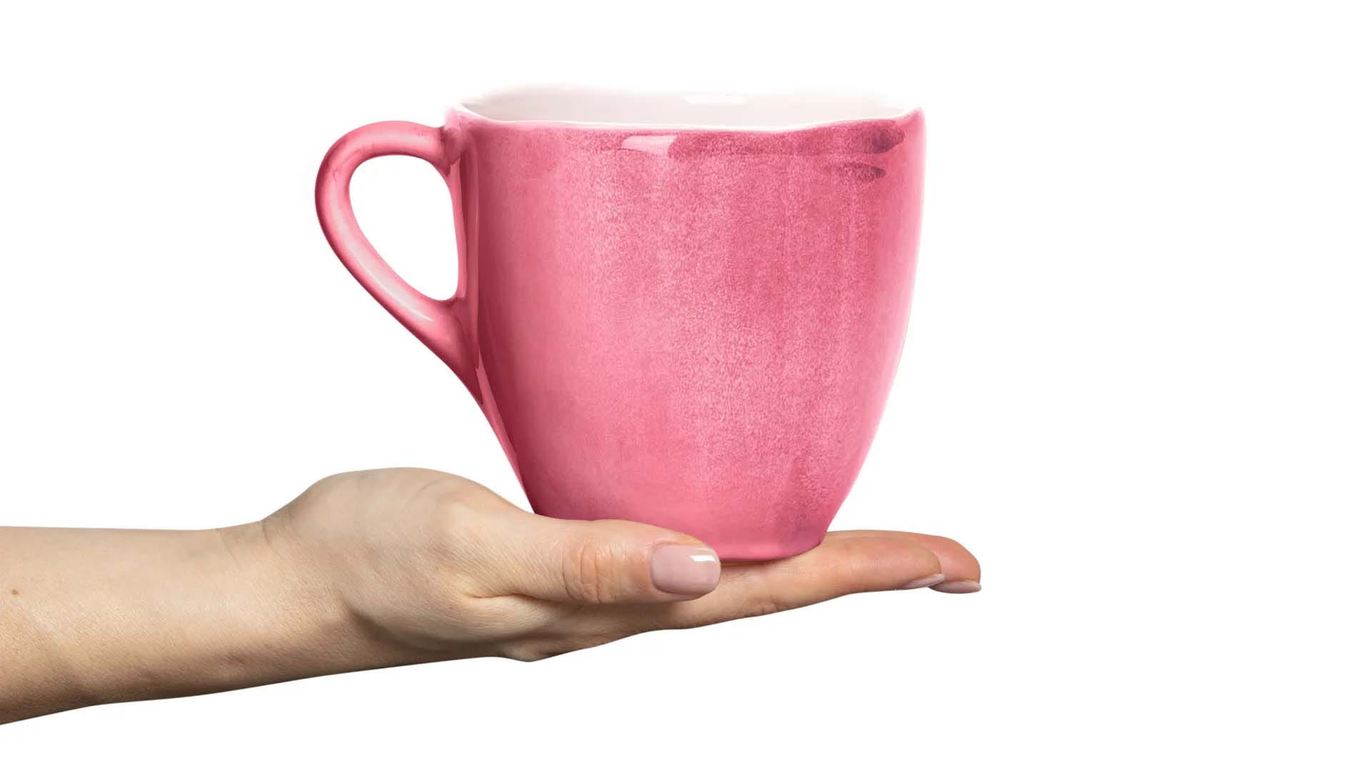 person holding a mug