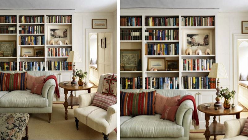 A sitting room with a full wall bookcase and neutral furnishings