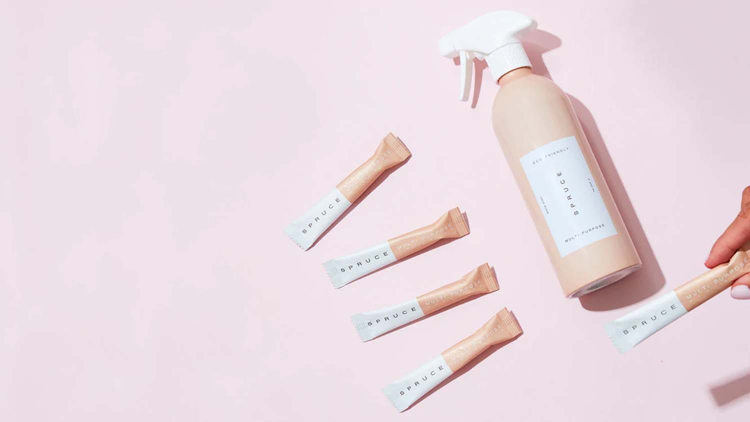 Spruce eco-friendly cleaning products including a reusable aluminium bottle and refill packets