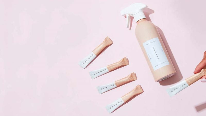 Spruce eco-friendly cleaning products including a reusable aluminium bottle and refill packets