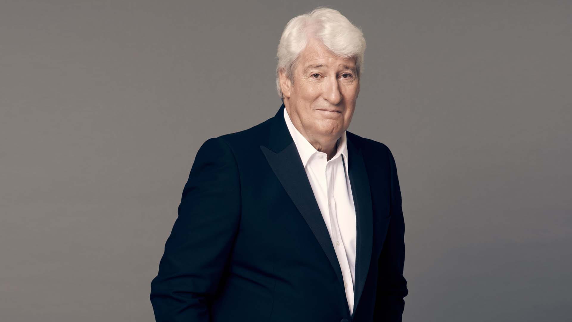 A photo of Jeremy Paxman in front of a plain background