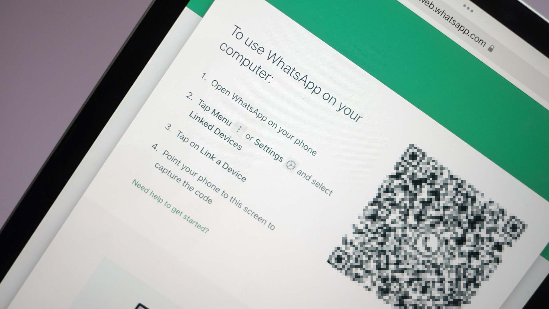 A phone displaying a QR code