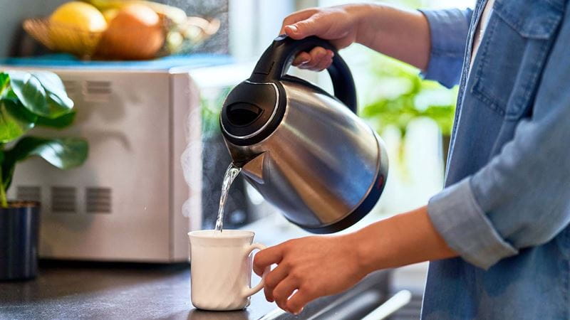 Kettle pouring tea