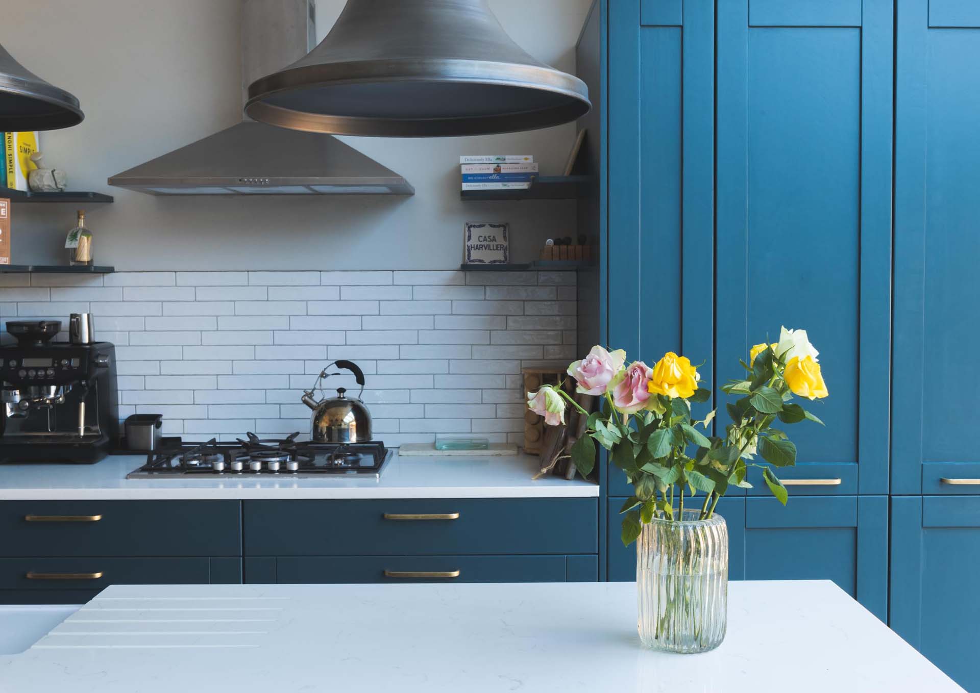 A freshly painted kitchen with blue cabinets