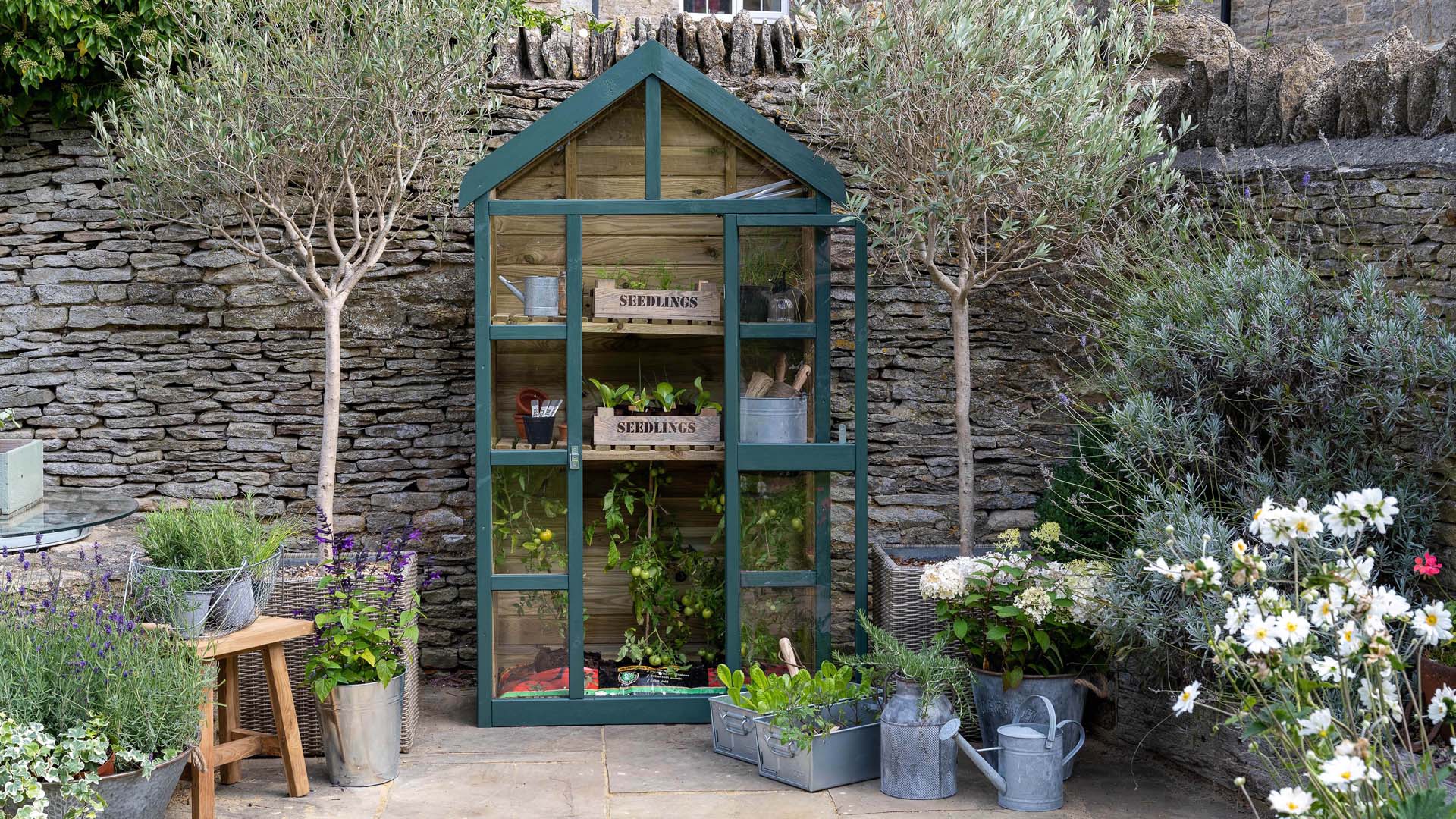 Greenhouse painted to suit the garden