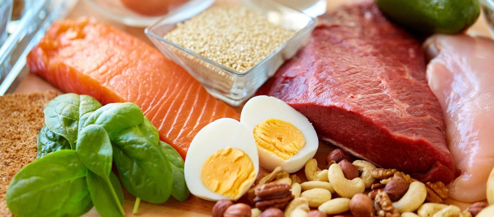 A spread of high protein foods including salmon, eggs and red meat | Shutterstock/Ground Picture