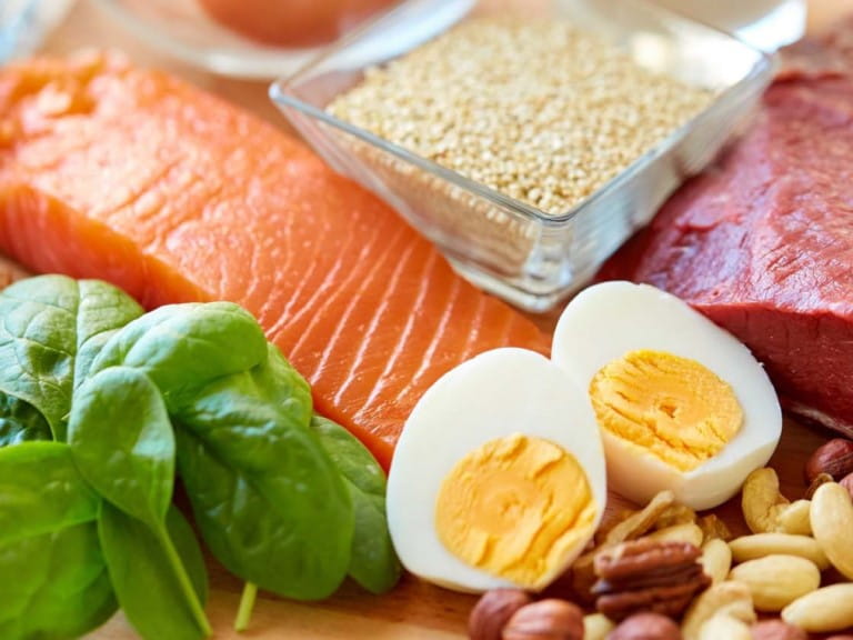 A spread of high protein foods including salmon, eggs and red meat | Shutterstock/Ground Picture