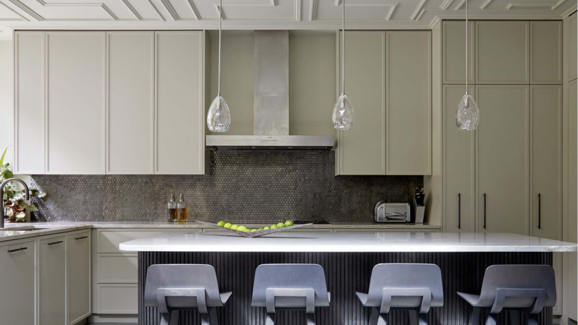 A cream kitchen by Hux  toughened up by a dark island 