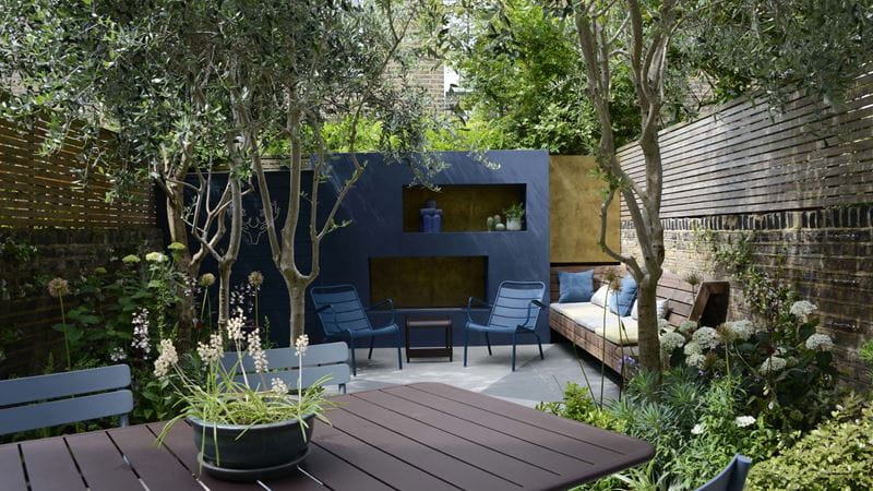 A dining area in a shaded courtyard