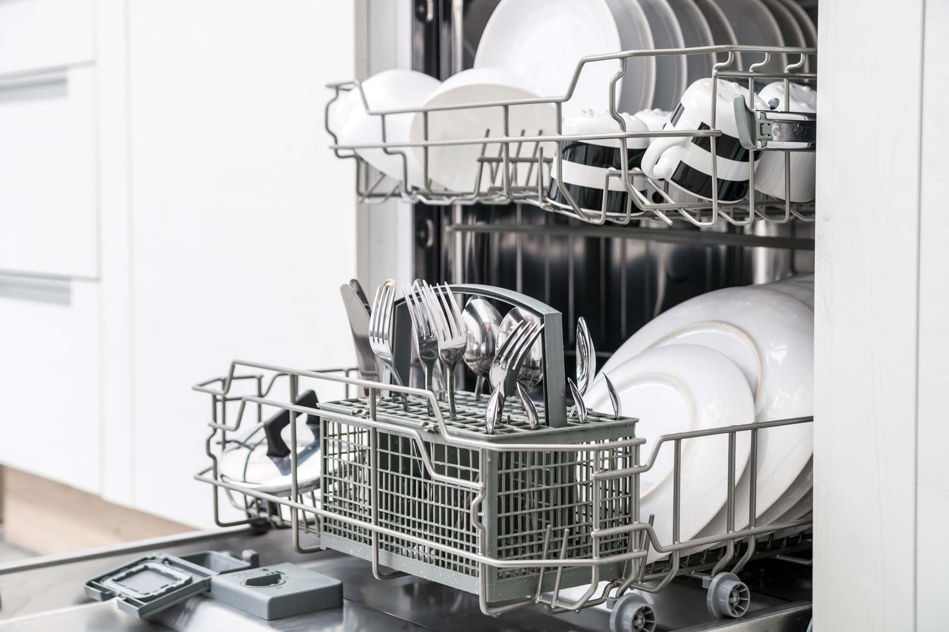 An open dishwasher displaying recently cleaned dishes