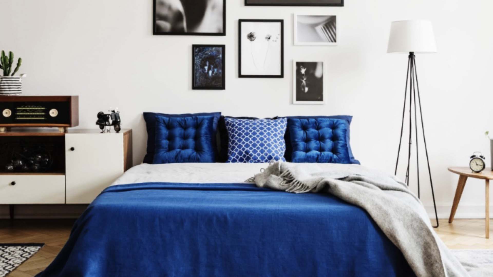 luxurious blue covered bed with pillows