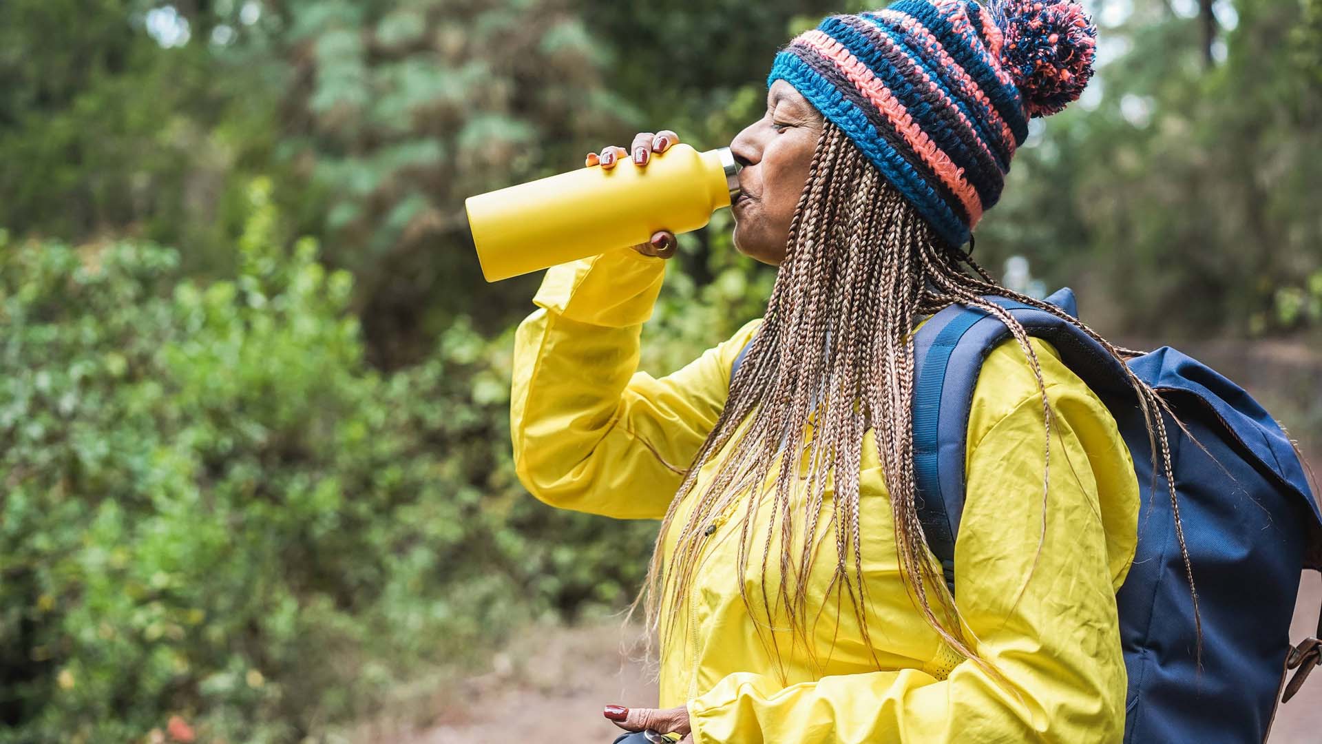 Older woman drinking water