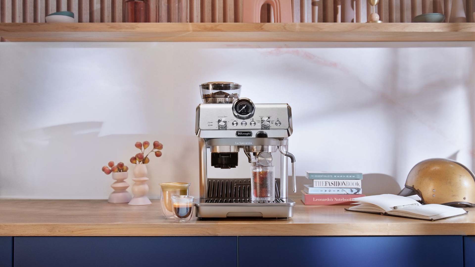A coffee machine with incorporated bean grinder on a wooden kitchen counter