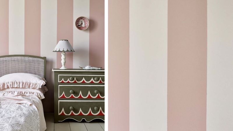 Wallpaper with large bold stripes in a bedroom