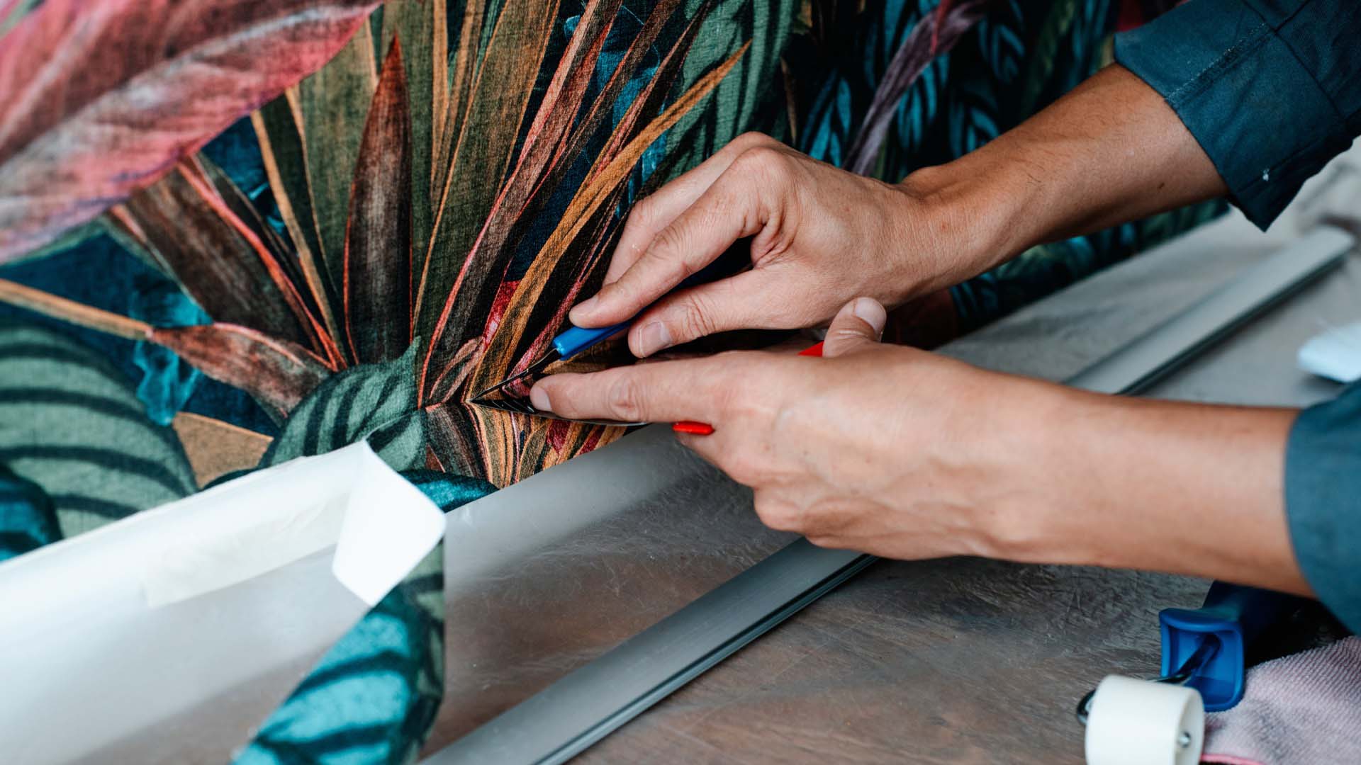 Man removing wallpaper