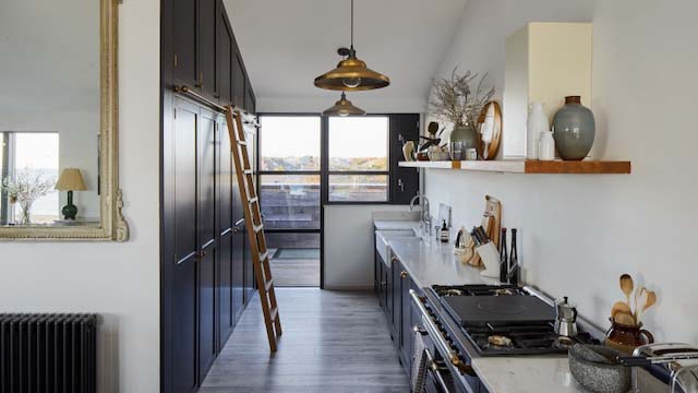 A black and white galley kitchen