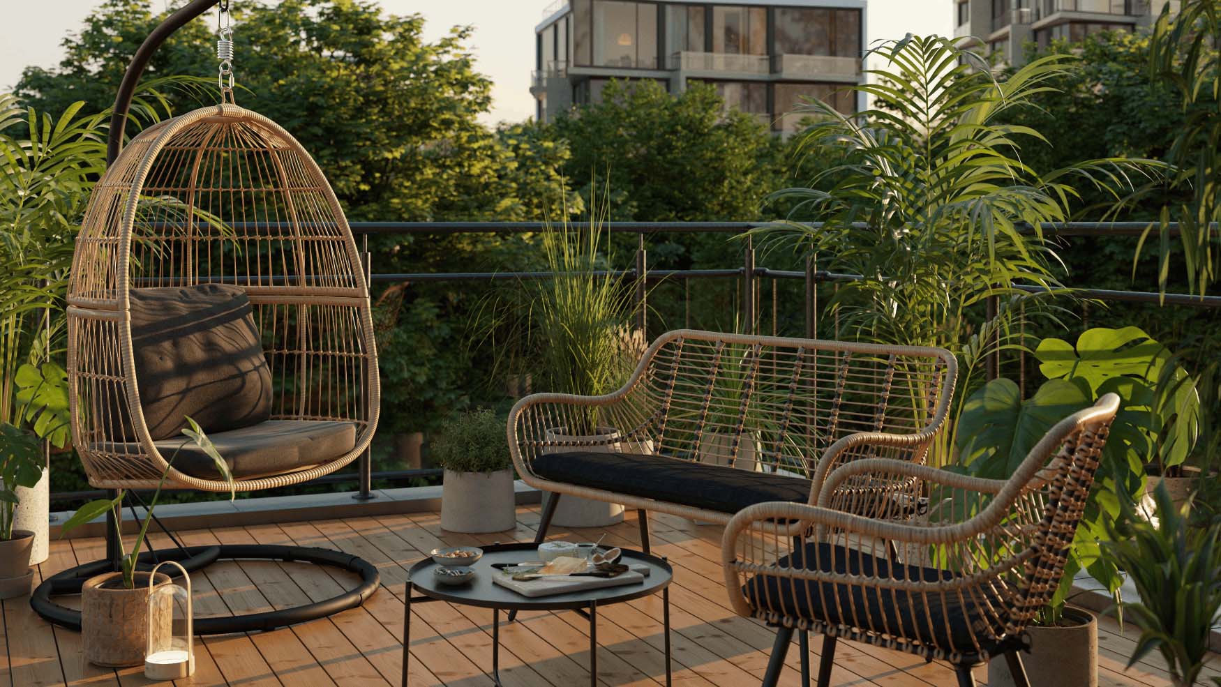 Bamboo garden set  with black cushions and coffee table on a balcony