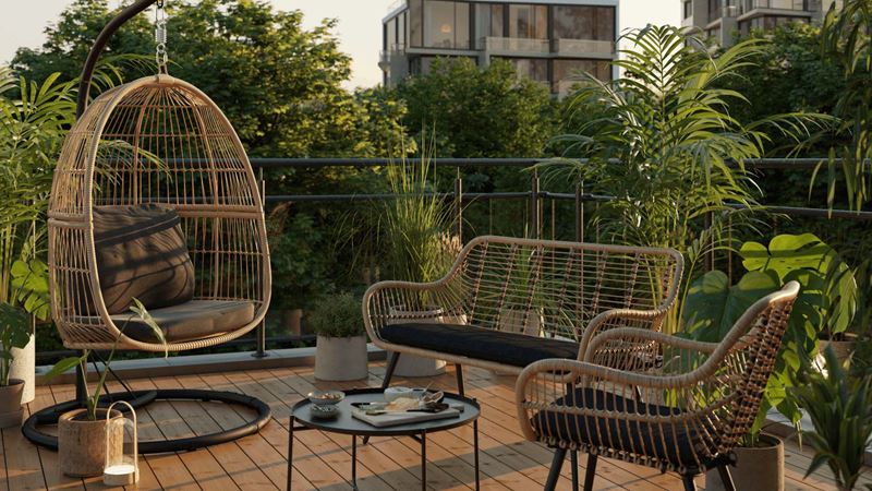 Bamboo garden set  with black cushions and coffee table on a balcony