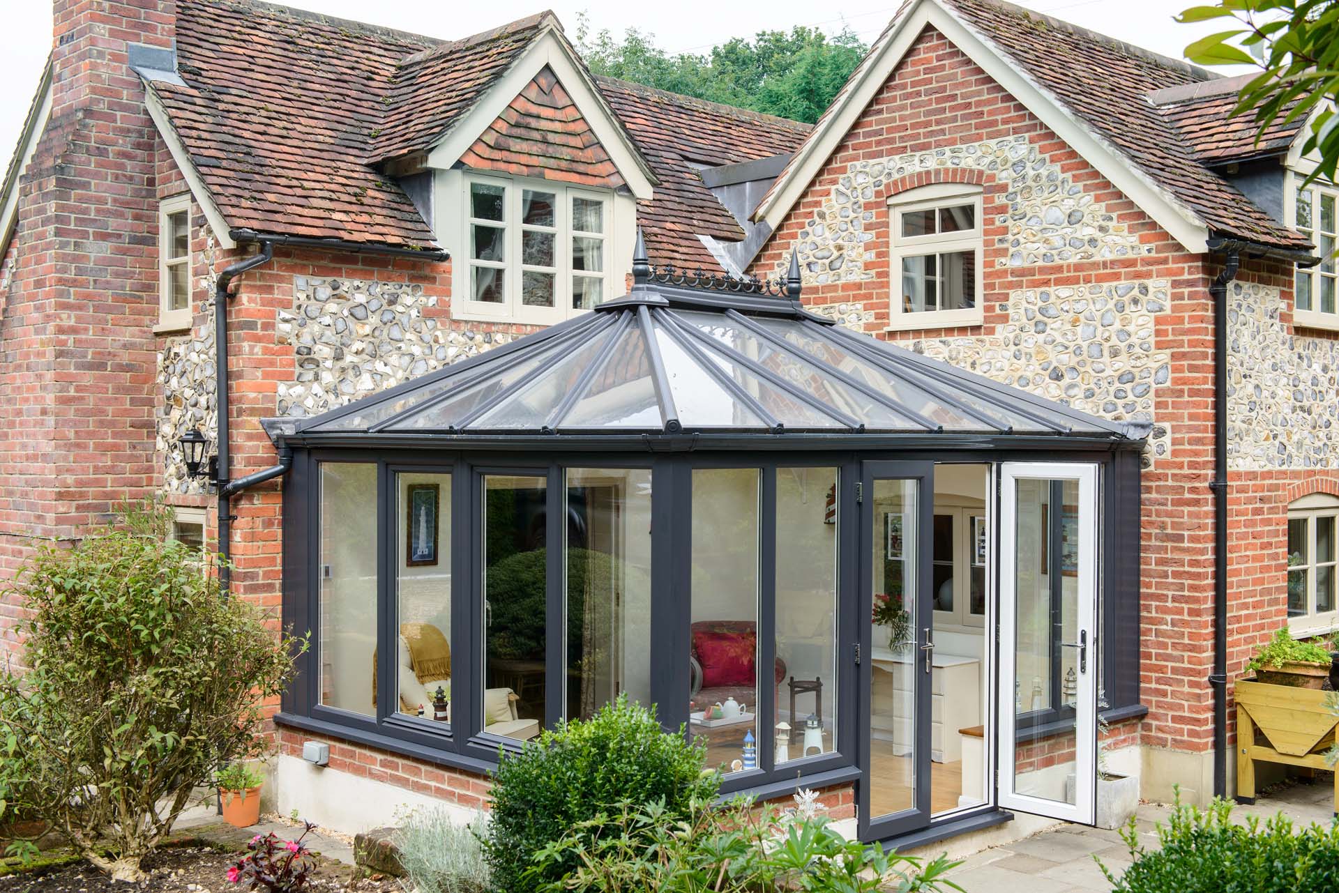 A conservatory with a reflective roof to repel heat