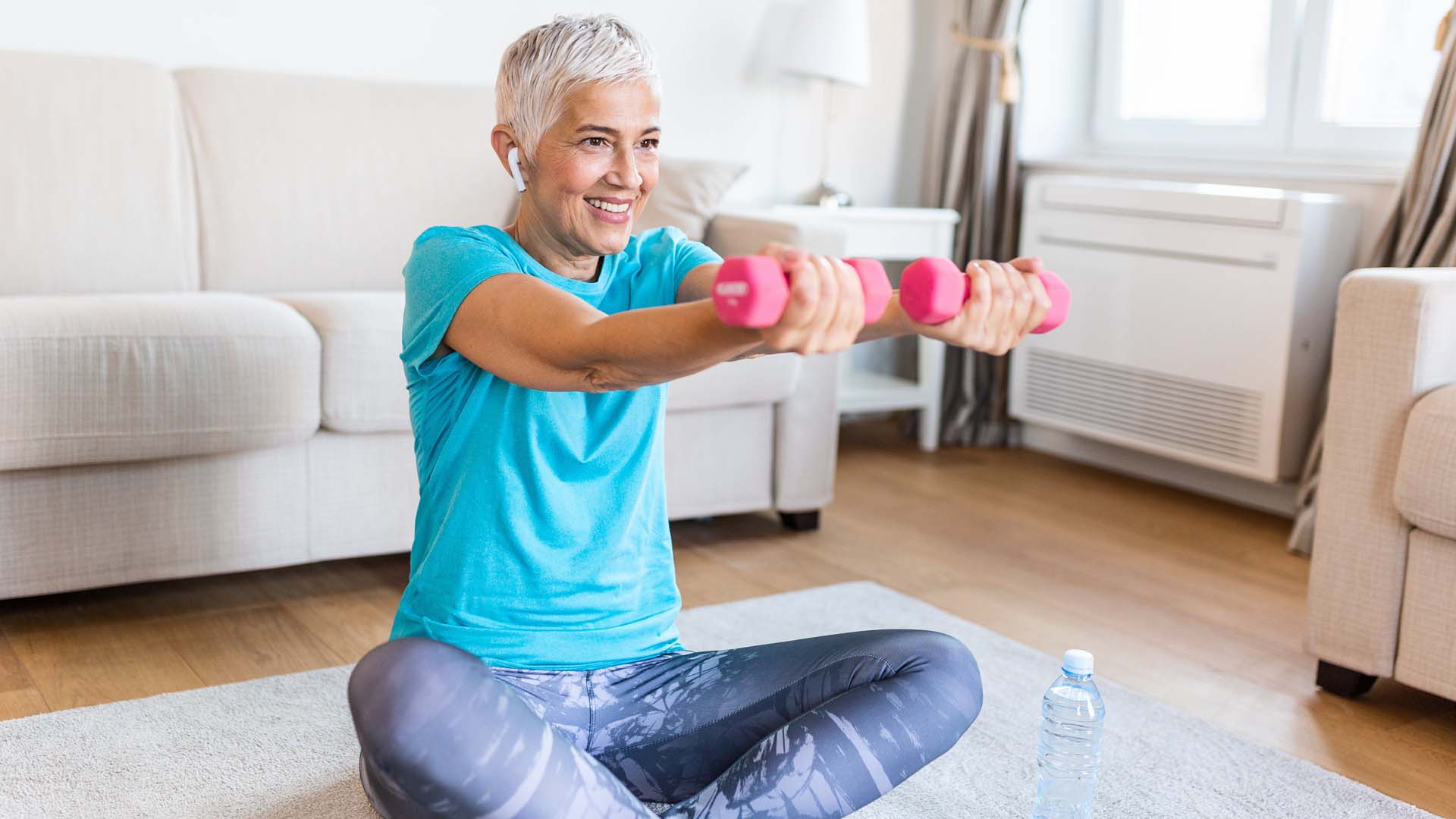 Female lifting weights at home