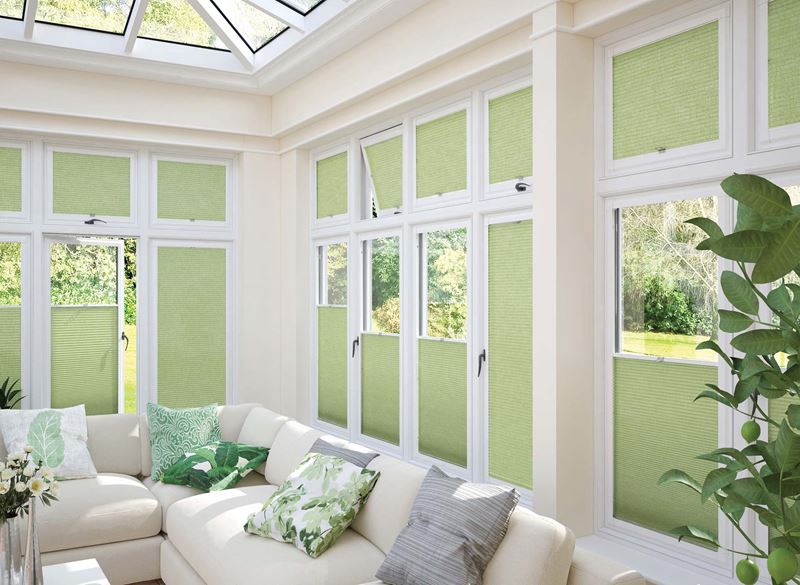 A conservatory with blinds mostly down