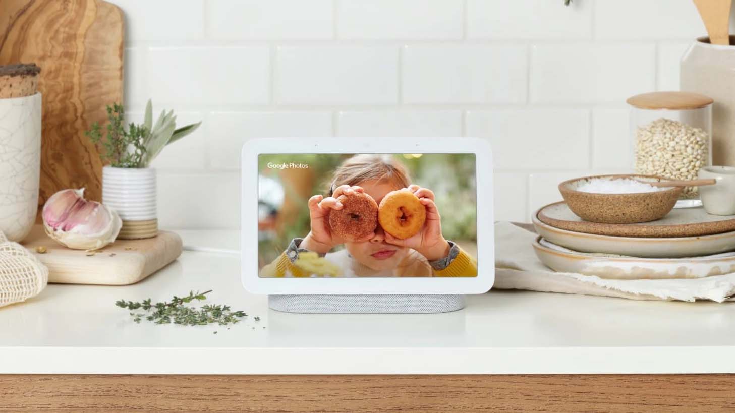A smart display being used as a photo album on a kitchen countertop