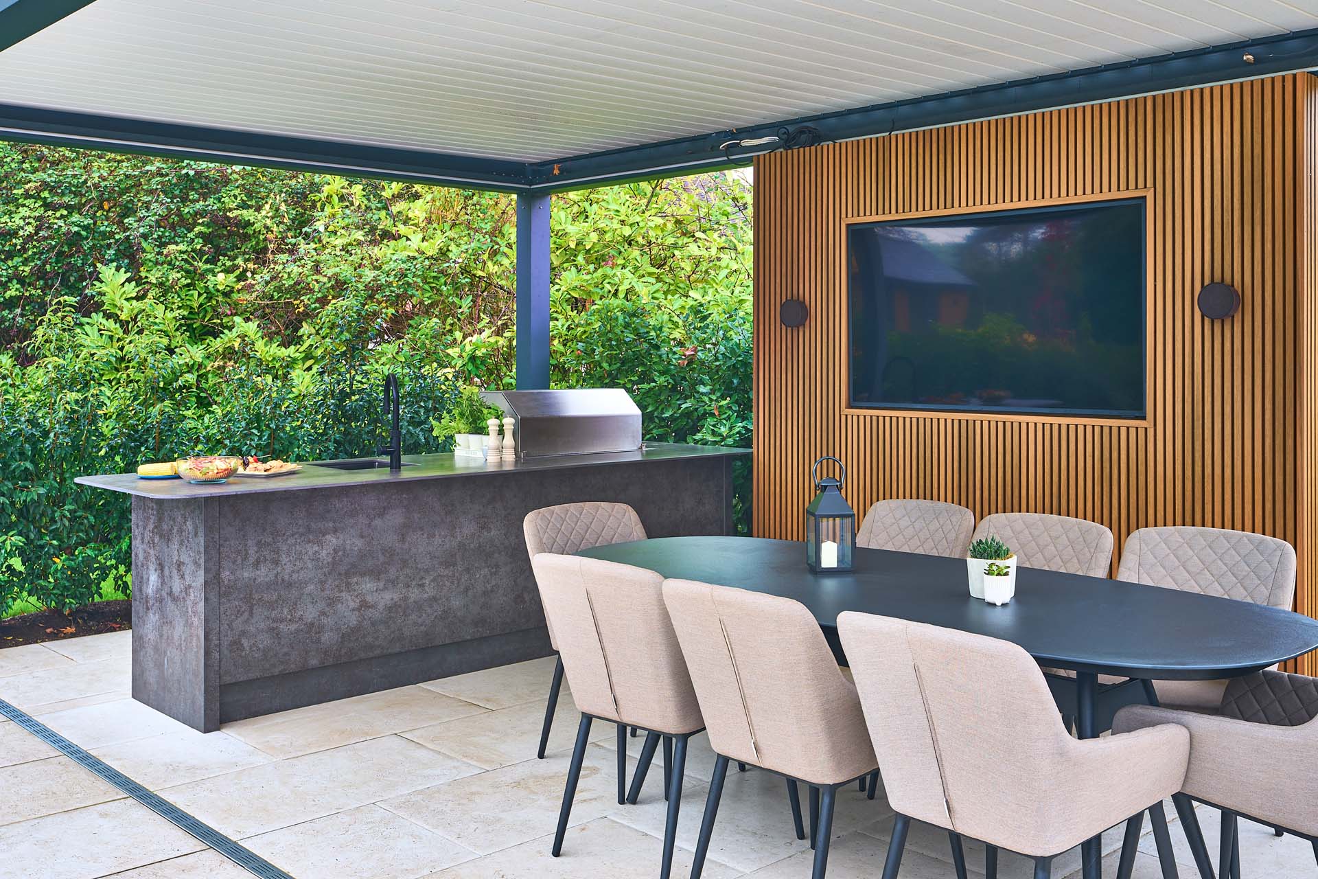 A conservatory with natural stone tiles to keep the room cool