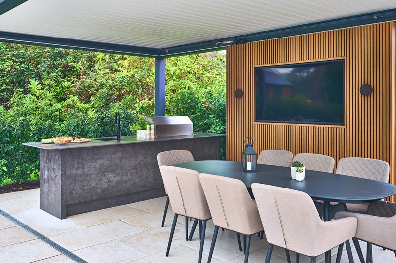 A conservatory with natural stone tiles to keep the room cool
