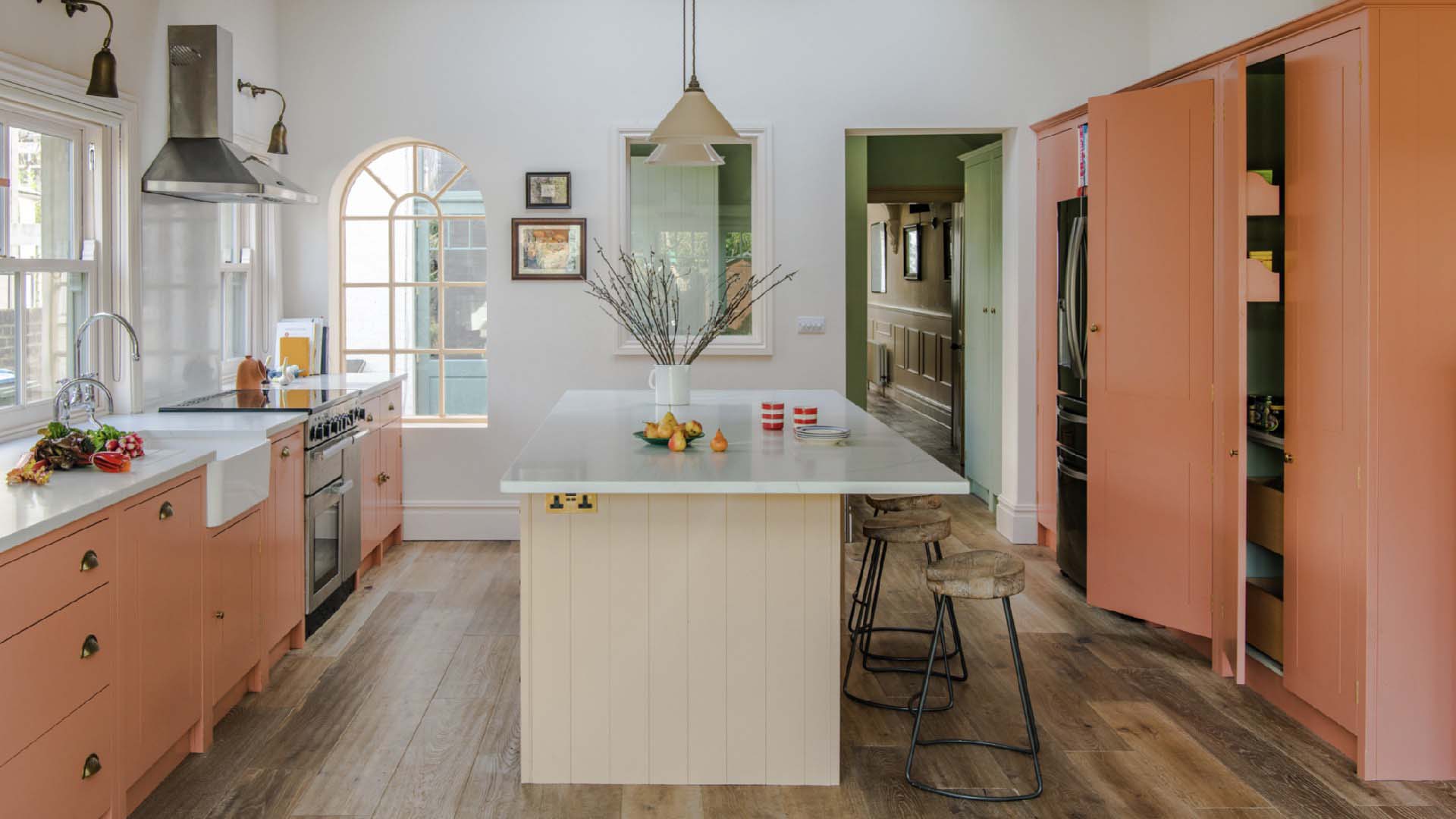 Cream and orange kitchen by British Standard