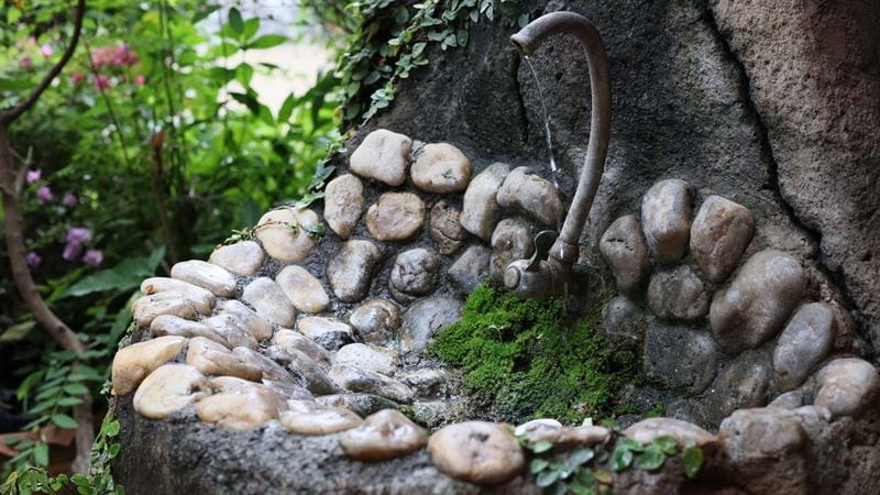 An outdoor sink made from natural looking stones